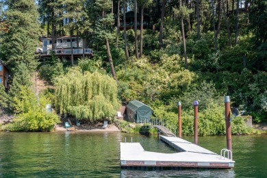 Welcome to your lakeside paradise on Lake Coeur d'Alene! Located - Lake Home For Sale in Coeur d Alene, Idaho