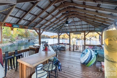This stunning waterfront ranch with basement offers the perfect - photo 3