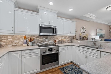 Experience luxury waterfront living in this beautifully updated - photo 8