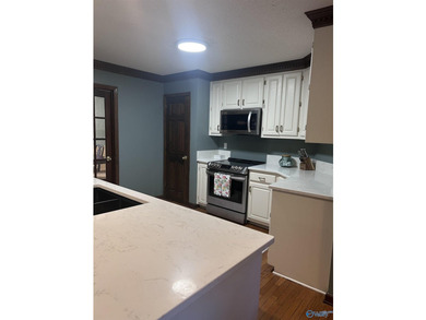 Welcome home to this beautifully renovated 4-bedroom residence - photo 6