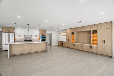 Presenting a COMPLETELY REMODELED 4-bedroom, 4-bath family home - photo 3