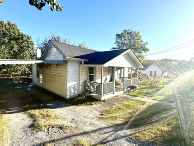 Want a nicely updated home with a good size backyard. This home - Lake Home For Sale in Lafollette, Tennessee