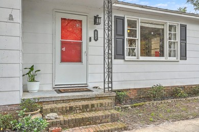 Tucked beneath mature trees in the heart of West Ashley, this - photo 3
