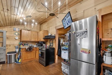 Nestled on nearly an acre, this charming three-bedroom - photo 14