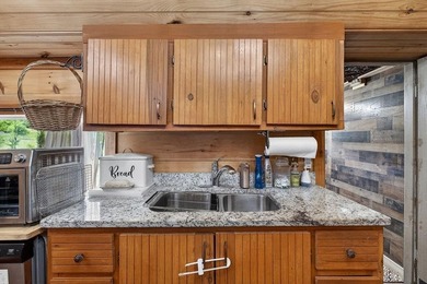 Nestled on nearly an acre, this charming three-bedroom - photo 16