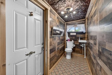Nestled on nearly an acre, this charming three-bedroom - photo 17