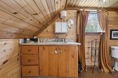 Nestled on nearly an acre, this charming three-bedroom - photo 25