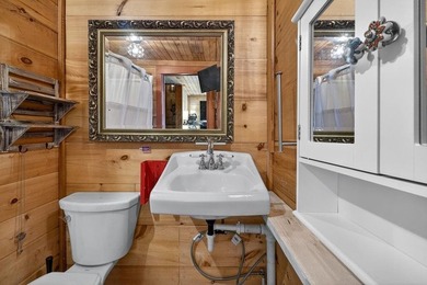 Nestled on nearly an acre, this charming three-bedroom - photo 28