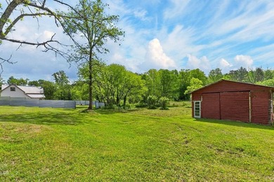 Nestled on nearly an acre, this charming three-bedroom - photo 34