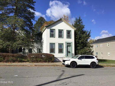 This family-owned two-family home has never been rented. First - photo 1