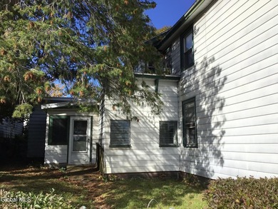 This family-owned two-family home has never been rented. First - photo 2