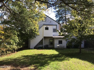 This family-owned two-family home has never been rented. First - photo 3