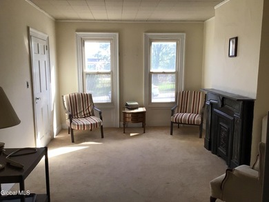 This family-owned two-family home has never been rented. First - photo 4