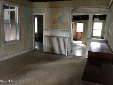 This family-owned two-family home has never been rented. First - photo 6