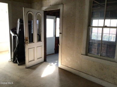This family-owned two-family home has never been rented. First - photo 7