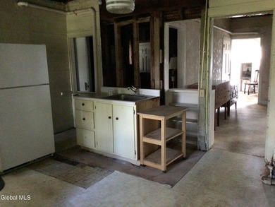 This family-owned two-family home has never been rented. First - photo 9