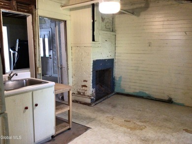 This family-owned two-family home has never been rented. First - photo 10