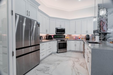 Welcome to this fully renovated lakefront home tucked away on a - photo 15