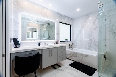 Welcome to this fully renovated lakefront home tucked away on a - photo 31