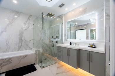 Welcome to this fully renovated lakefront home tucked away on a - photo 32