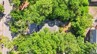 Tucked beneath a canopy of mature trees just minutes from the - photo 47