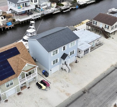 Stunning newer construction waterfront home in sought after - photo 1