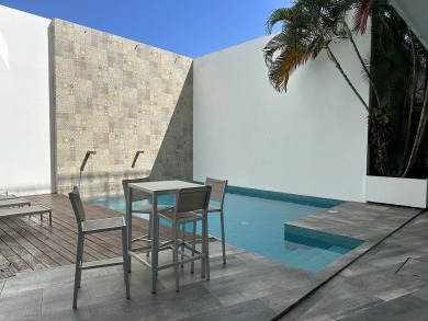 This beautiful garden level condo for sale on Calle 38 in Playa