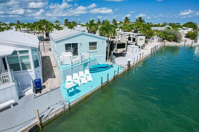 Spectacular peekaboo open water views abound with this updated 2 - photo 1