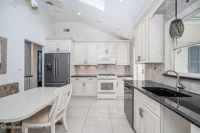 Discover 72 Reading Avenue-a two family Broadside Ranch tucked - photo 12