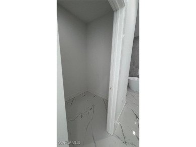 This stunning new construction features impact windows and doors - photo 10