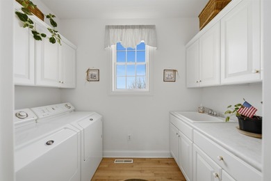 Perched along a pristine stretch of shoreline, this ideal lake - photo 19