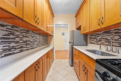 Welcome to your new home in the heart of Forest Hills! This