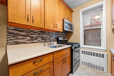Welcome to your new home in the heart of Forest Hills! This