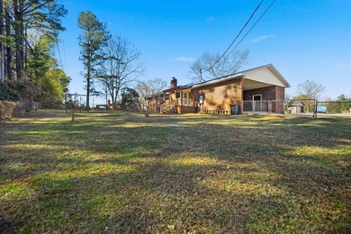 Welcome home to the charming 3-bedroom, 2-bath brick ranch on a