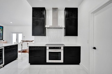 $35,000 ROOF CREDIT. NEW: AC, IMPACT WINDOWS & CUSTOM KITCHEN - photo 14