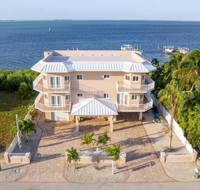 Experience elevated Florida Keys living at this exceptional - photo 1