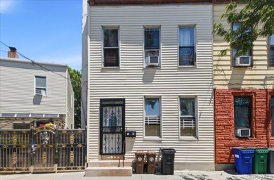 Two family home for sale in the Morris Park/ Van Nest area of - photo 1