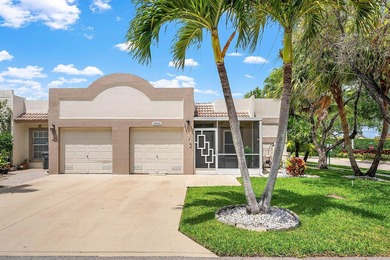 Tucked away as a private end-unit in desirable Town Villas, this - photo 1