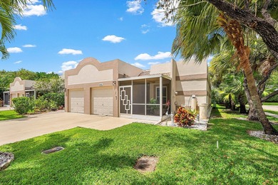 Tucked away as a private end-unit in desirable Town Villas, this - photo 2
