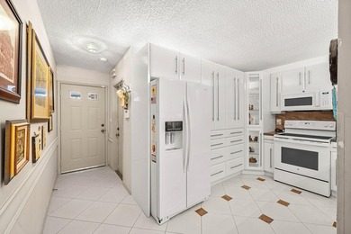 Tucked away as a private end-unit in desirable Town Villas, this - photo 5