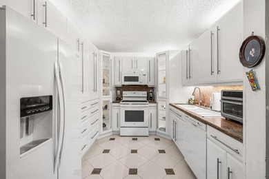 Tucked away as a private end-unit in desirable Town Villas, this - photo 6
