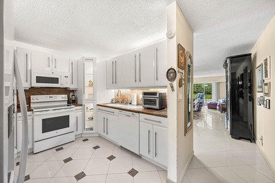 Tucked away as a private end-unit in desirable Town Villas, this - photo 7