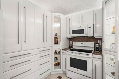 Tucked away as a private end-unit in desirable Town Villas, this - photo 8