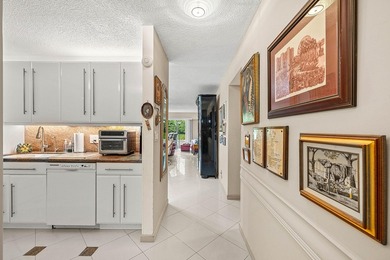 Tucked away as a private end-unit in desirable Town Villas, this - photo 9