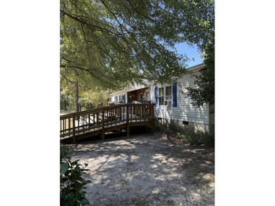 Welcome to 5+ private acres in New Ellenton! This spacious 3