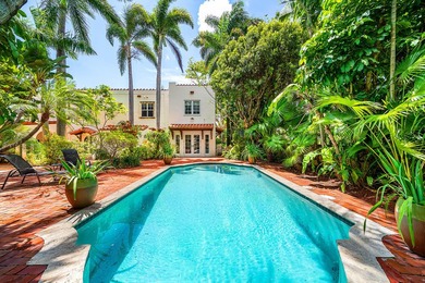This iconic 1920's Mediterranean Revival Home blends historic - photo 4