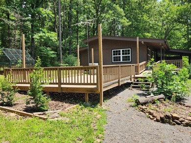In the heart of Fairfield Bay nestled among the trees for - photo 2