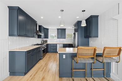 Recently expanded and renovated with a fresh, modern coastal - photo 13
