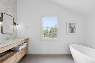 Recently expanded and renovated with a fresh, modern coastal - photo 18