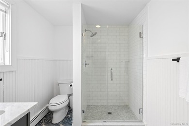 Recently expanded and renovated with a fresh, modern coastal - photo 24